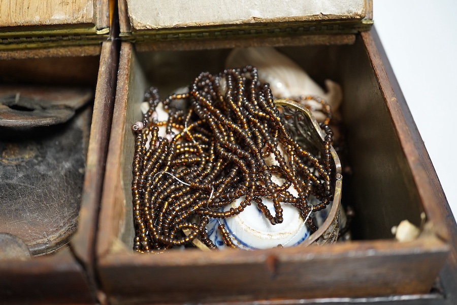 A Regency rosewood tea caddy, three pairs of nut crackers including a novelty skull nut cracker, a plated bowl, two napkin rings and a Wedgwood dish. Condition - varies